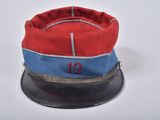 a red and blue hat with the number 12 on it