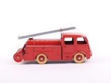 a red toy fire truck with a ladder on top of it