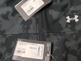 two tags on the back of a black jacket