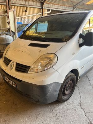 a white van parked in a garage next to a building