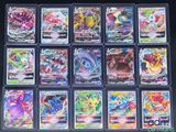 a close up of a bunch of pokemon cards on a table