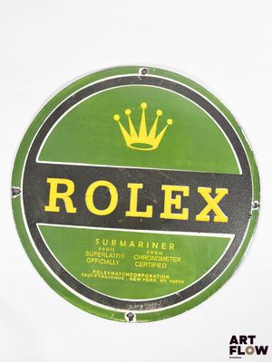 a green and black sign with a crown on it