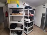a room that has a bunch of shelves in it