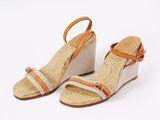 an image of a pair of wedged sandals on a white background