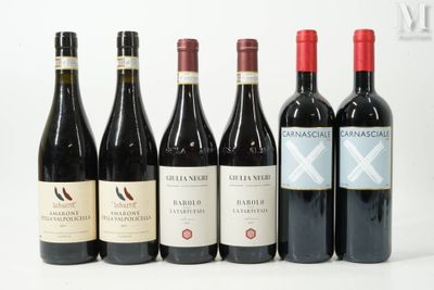 plusieurs bouteilles de vin sont alignées sur une surface blanche