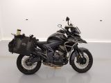 a picture of a black motorcycle parked in a white room