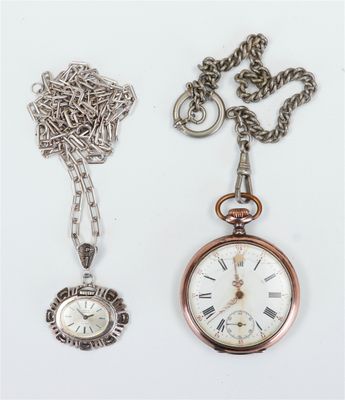 two different types of watches and a chain on a table