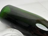 a bottle of wine and a glass on a table