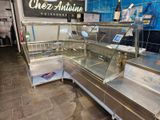 a counter with a variety of food items inside of it