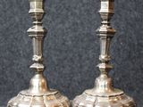 two candles that are sitting on a table