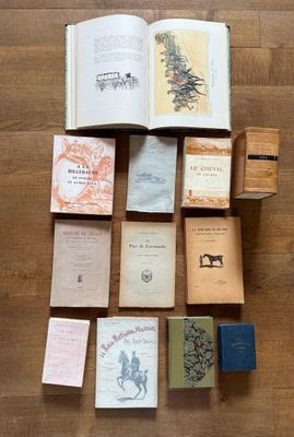 a lot of books that are sitting on the floor