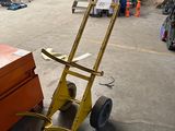 a hand truck that is sitting in a warehouse