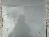 a reflection of a person in a mirror on the ground