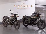 two motorcycles parked next to each other in a garage