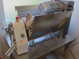 a machine that is sitting on a table in a kitchen