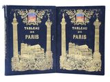 les deux livres sont ouverts sur un fond blanc, avec une couverture bleue