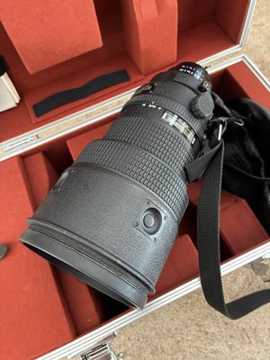a camera in a case with a camera strap on it
