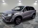 the silver suv is parked on a checkered floor in a garage