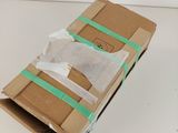 a cardboard box with a piece of tape on top of it