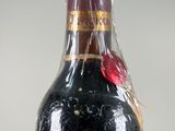 a bottle of wine that is sitting on a table