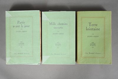 three books sitting on top of a table next to each other