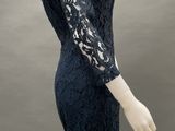 an image of a mannequin wearing a black lace dress