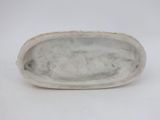 an antique silver plate with a handle on a white background