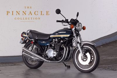 a motorcycle that is parked in front of a wall