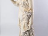an image of a statue of a woman holding a bird in her hand