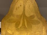 gold plated bookend with a design of flowers and leaves