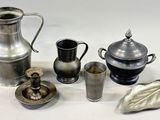 a lot of silver items that are on the table