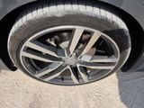 a close up of a tire on a car ' s rim