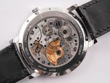 a close up of a watch on a white surface