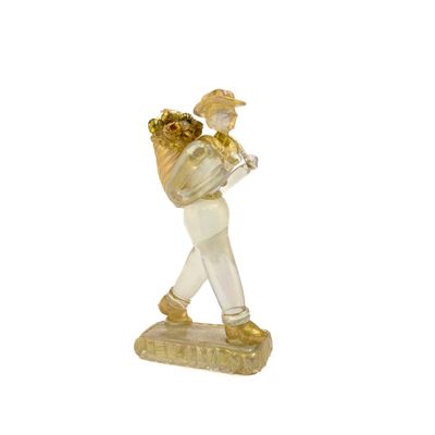 figurine représentant un joueur de baseball tenant une batte sur une base