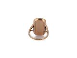 a close up of a gold ring with a brown stone on it