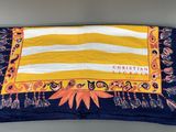 a close up of a yellow and blue blanket on a table