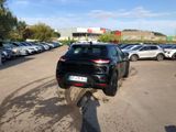 a black suv parked in a parking lot next to other cars