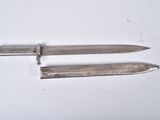 two knives that are laying on top of each other