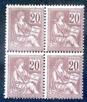 four postage stamps with a woman sitting on a bench