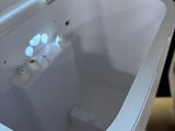 a white toilet with a white lid and a white seat