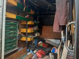 an image of the inside of a van with many items in it
