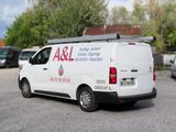 a white van that is parked in a parking lot