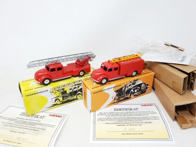 MÄRKLIN (éch 1/55ème, zamac), 2 camions Magirus-Deutz de pom…