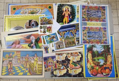 many different pictures on the floor of this room