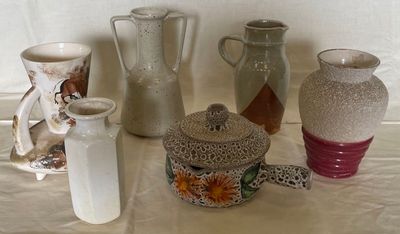 many different types of vases on the table