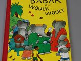 a yellow book with a picture of a group of elephants