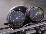 two gauges on the handlebars of a motorcycle