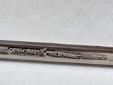 a close up of a spoon on a white surface