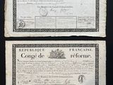 two old french currency notes on a black background