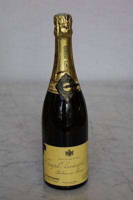 an image of a bottle of champagne sitting on a table